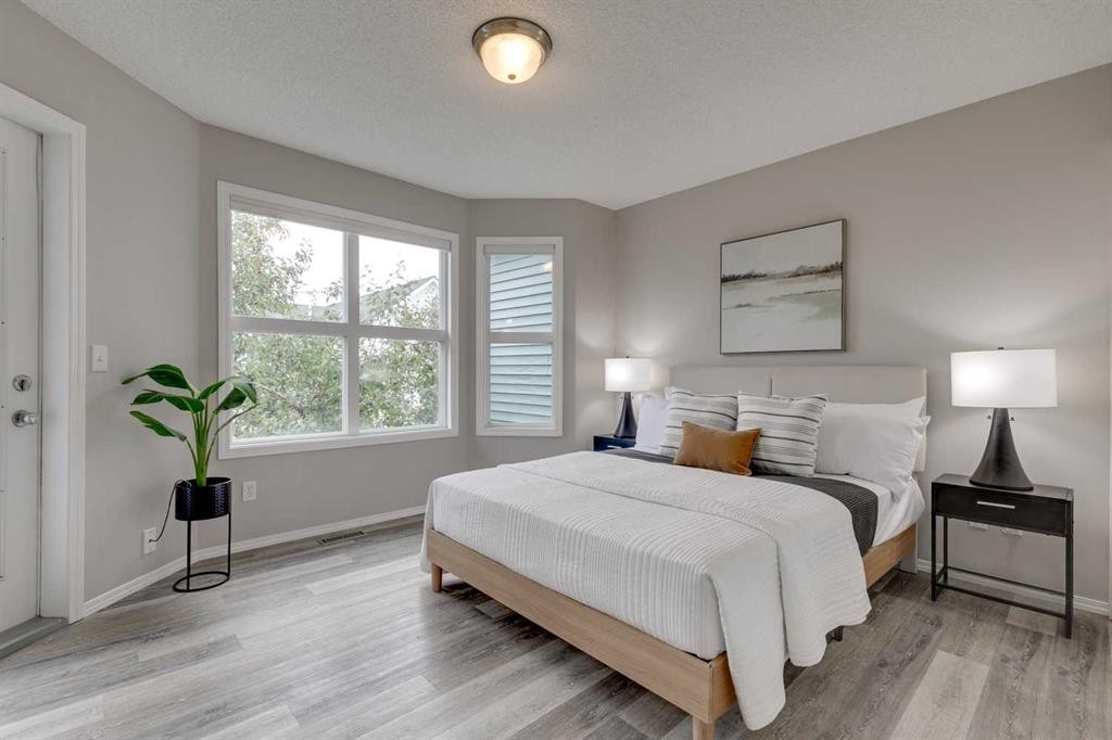 910 Prairie Sound Circle Nw, High River, AB - Indoor Photo Showing Bedroom