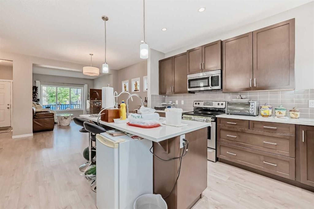 9 Copperpond Avenue Se, Calgary, AB - Indoor Photo Showing Kitchen With Upgraded Kitchen