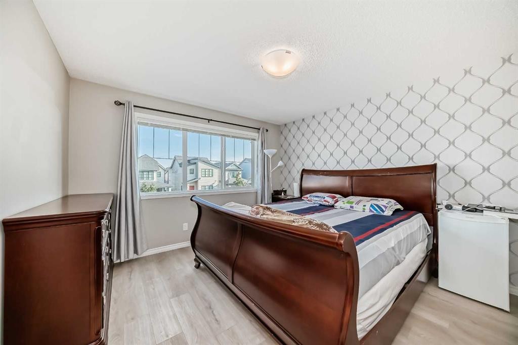 9 Copperpond Avenue Se, Calgary, AB - Indoor Photo Showing Bedroom