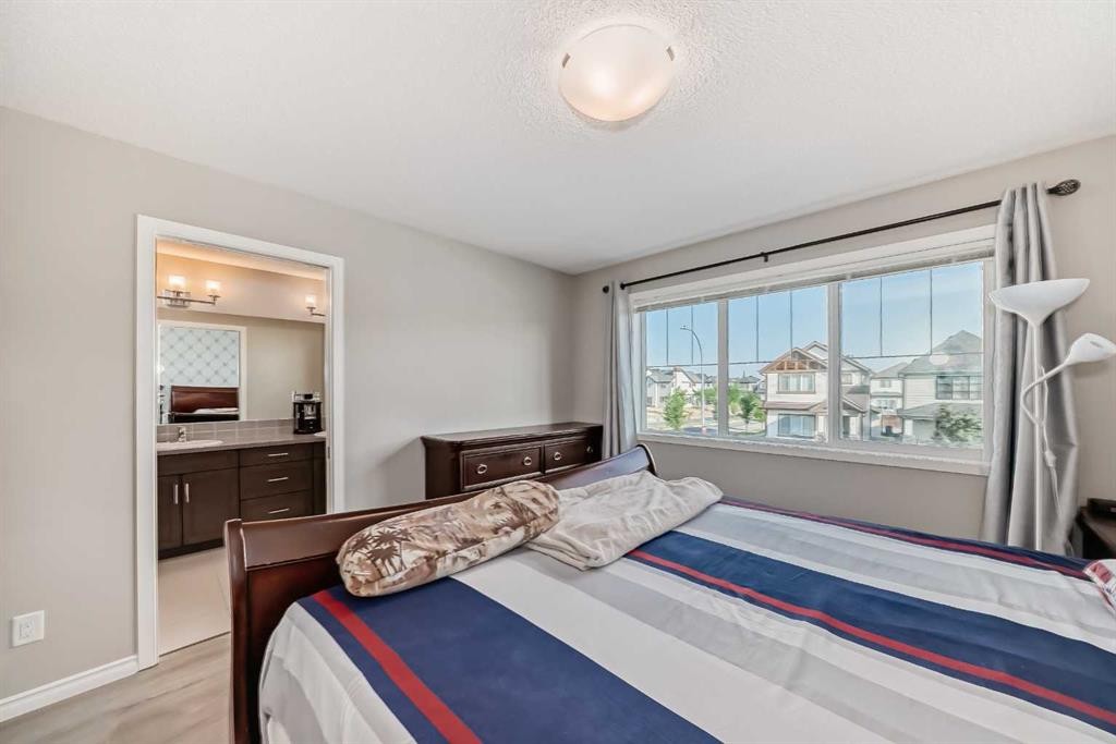 9 Copperpond Avenue Se, Calgary, AB - Indoor Photo Showing Bedroom