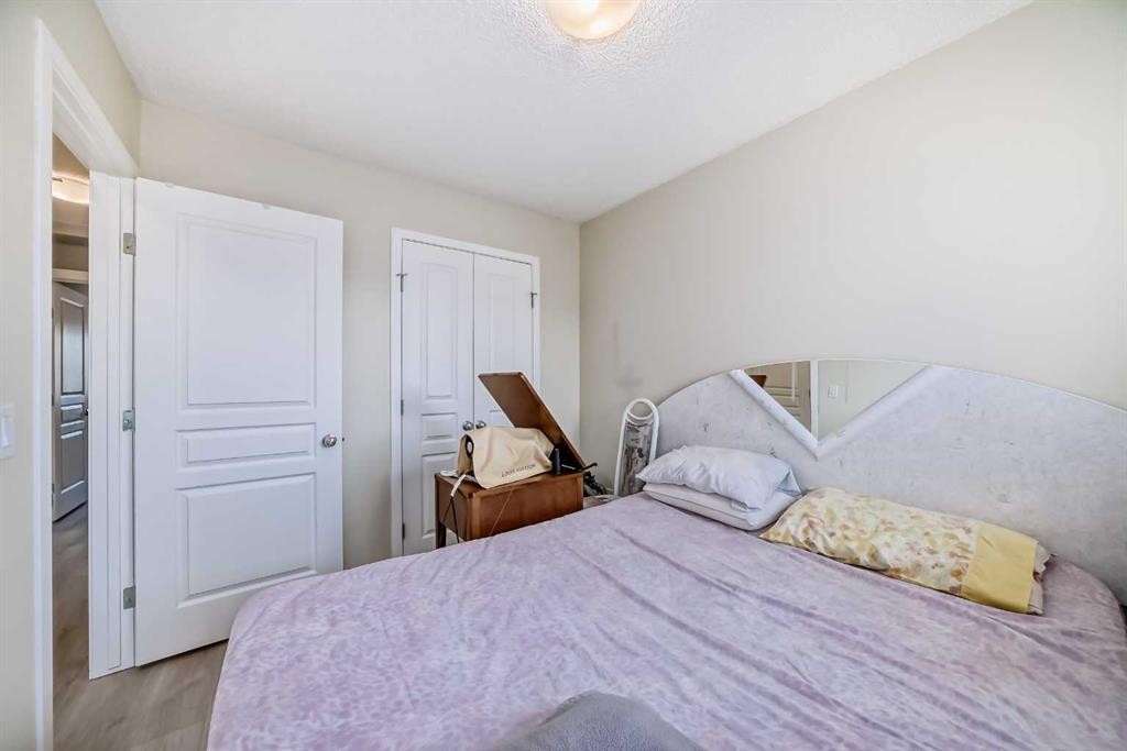 9 Copperpond Avenue Se, Calgary, AB - Indoor Photo Showing Bedroom
