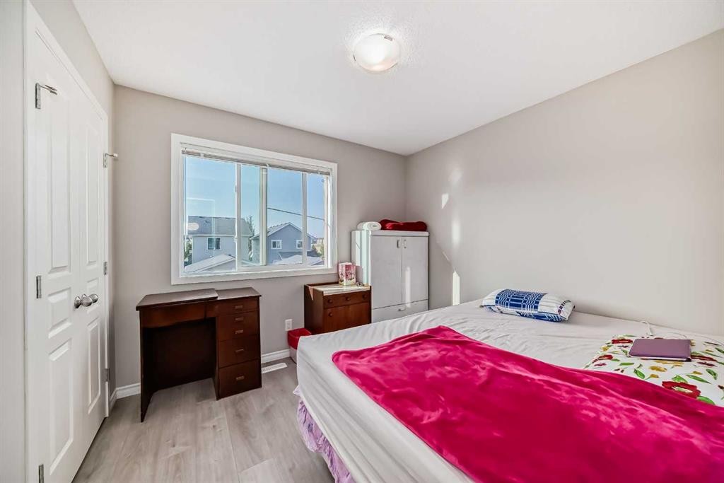 9 Copperpond Avenue Se, Calgary, AB - Indoor Photo Showing Bedroom