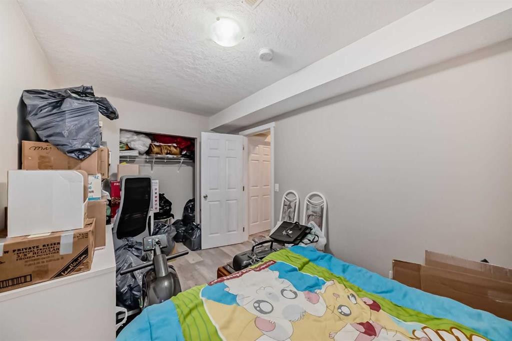 9 Copperpond Avenue Se, Calgary, AB - Indoor Photo Showing Bedroom