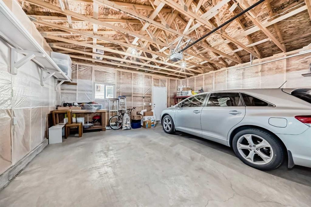 9 Copperpond Avenue Se, Calgary, AB - Indoor Photo Showing Garage