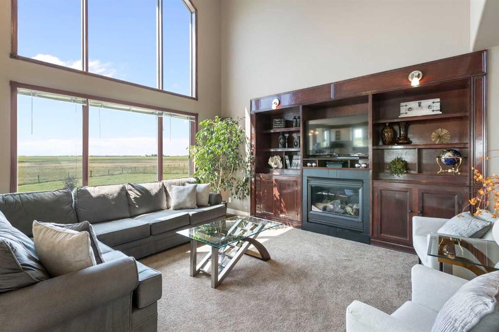 250257 271 Range Road, Rural Rocky View County, AB - Indoor Photo Showing Living Room With Fireplace