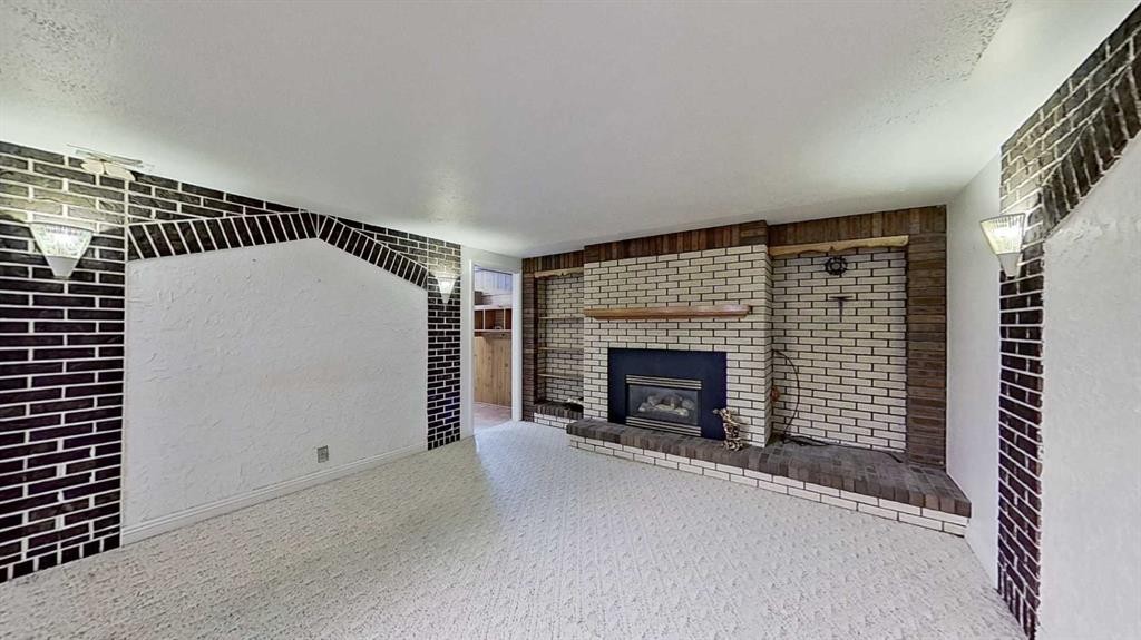 47 Montrose Crescent Ne, Calgary, AB - Indoor With Fireplace