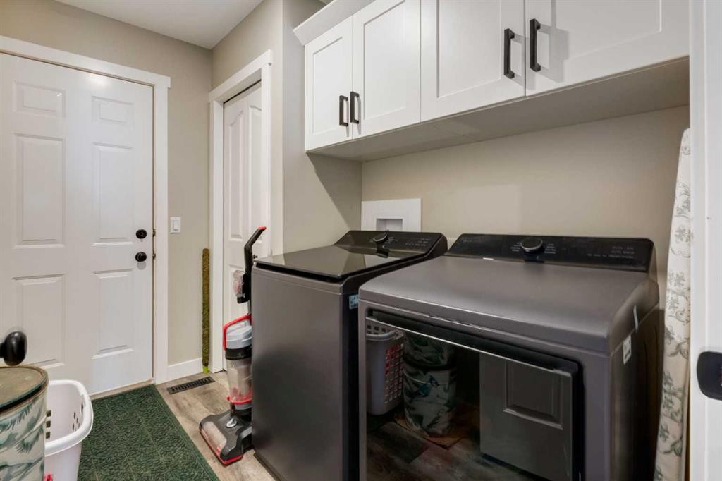 26 Eagleview Way, Cochrane, AB - Indoor Photo Showing Laundry Room