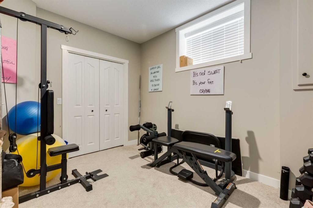 26 Eagleview Way, Cochrane, AB - Indoor Photo Showing Gym Room