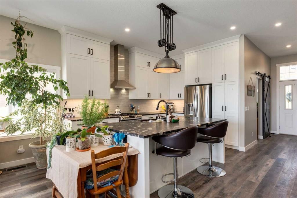 26 Eagleview Way, Cochrane, AB - Indoor Photo Showing Kitchen With Stainless Steel Kitchen With Upgraded Kitchen