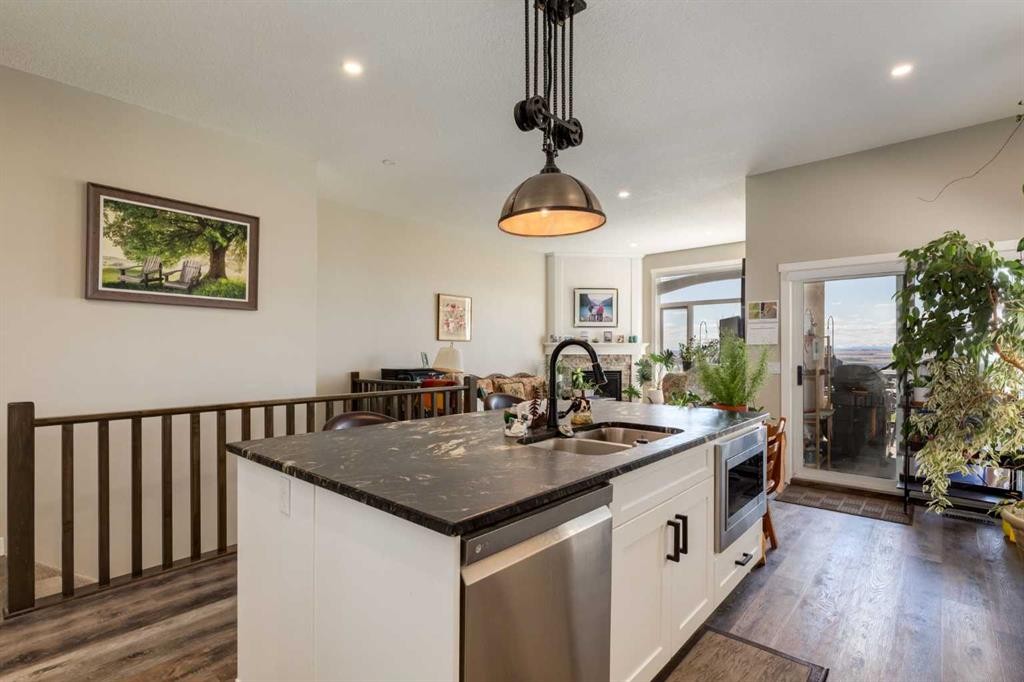 26 Eagleview Way, Cochrane, AB - Indoor Photo Showing Kitchen With Double Sink