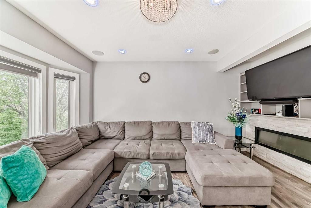 42 Taraglen Road Ne, Calgary, AB - Indoor Photo Showing Living Room With Fireplace