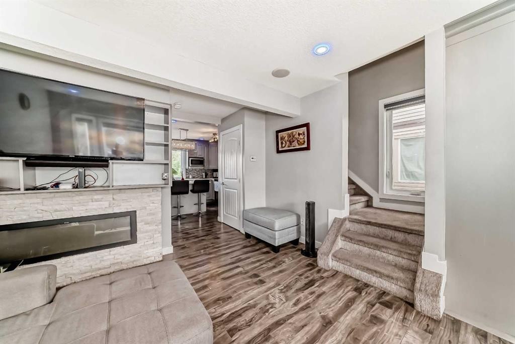 42 Taraglen Road Ne, Calgary, AB - Indoor With Fireplace
