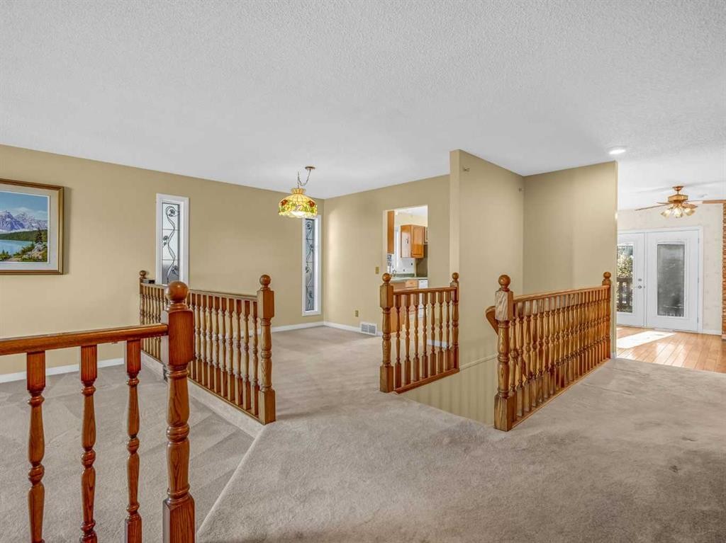 76 Wood Valley Rise Sw, Calgary, AB - Indoor Photo Showing Other Room