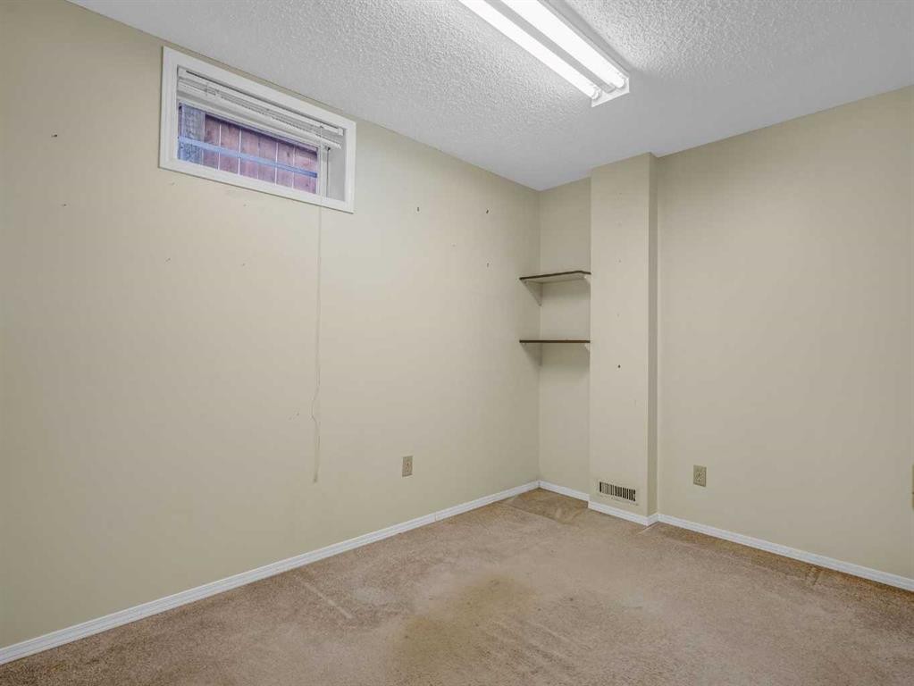 76 Wood Valley Rise Sw, Calgary, AB - Indoor Photo Showing Other Room