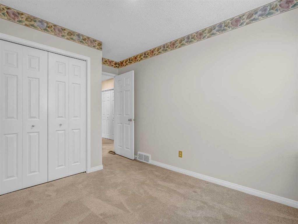 76 Wood Valley Rise Sw, Calgary, AB - Indoor Photo Showing Other Room
