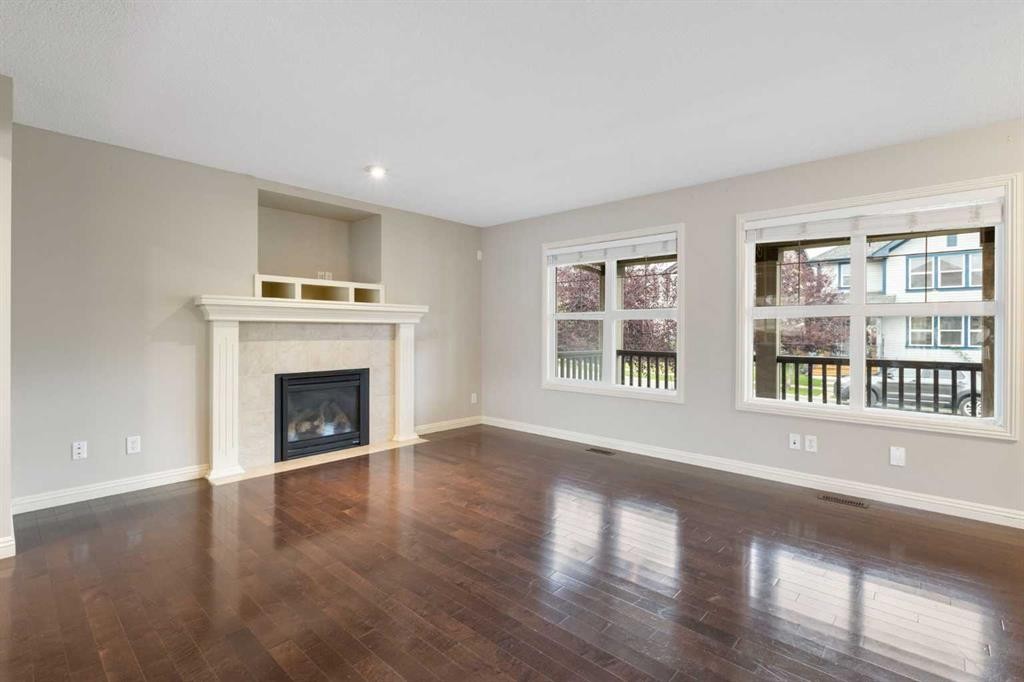 221 Prestwick Terrace Se, Calgary, AB - Indoor Photo Showing Living Room With Fireplace