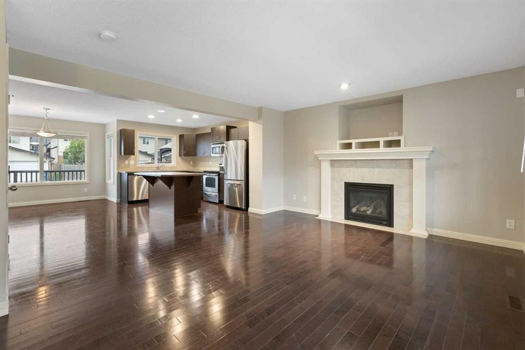 221 Prestwick Terrace Se, Calgary, AB - Indoor Photo Showing Living Room With Fireplace