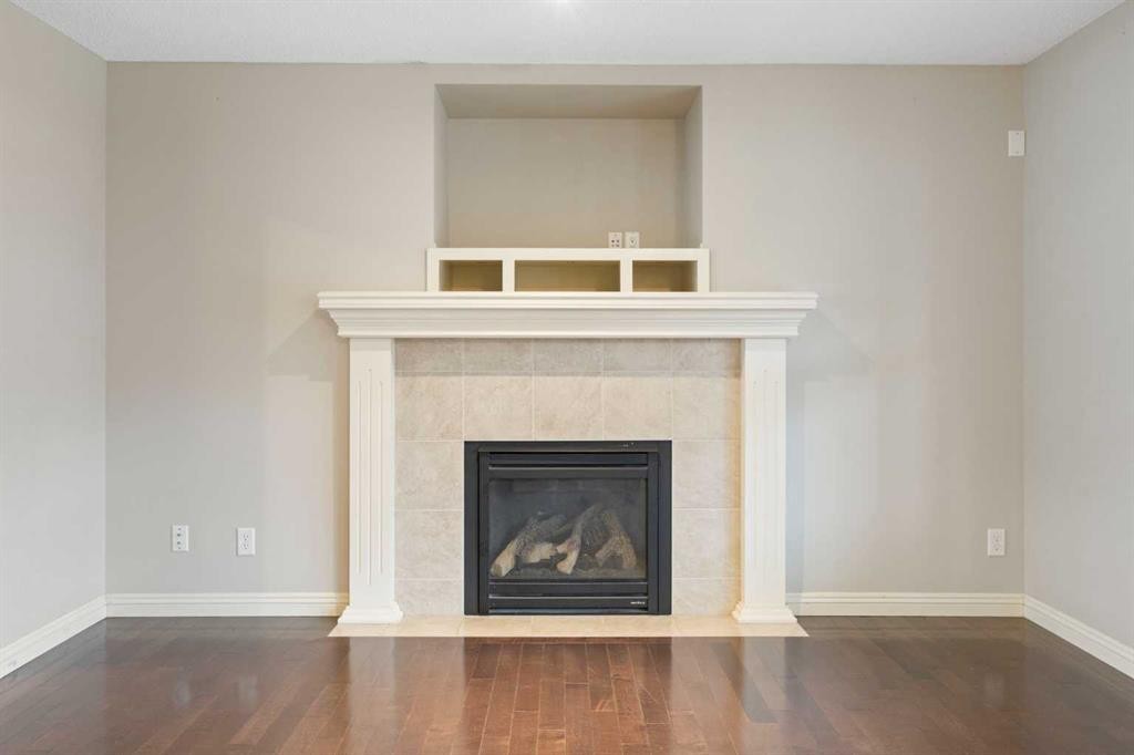 221 Prestwick Terrace Se, Calgary, AB - Indoor Photo Showing Other Room With Fireplace