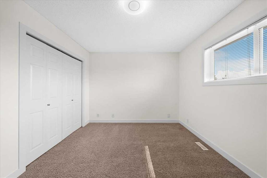 61 Falmere Way Ne, Calgary, AB - Indoor Photo Showing Other Room