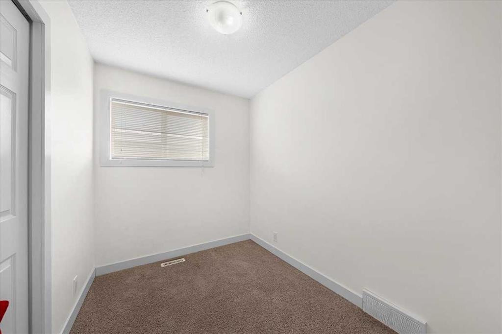 61 Falmere Way Ne, Calgary, AB - Indoor Photo Showing Other Room