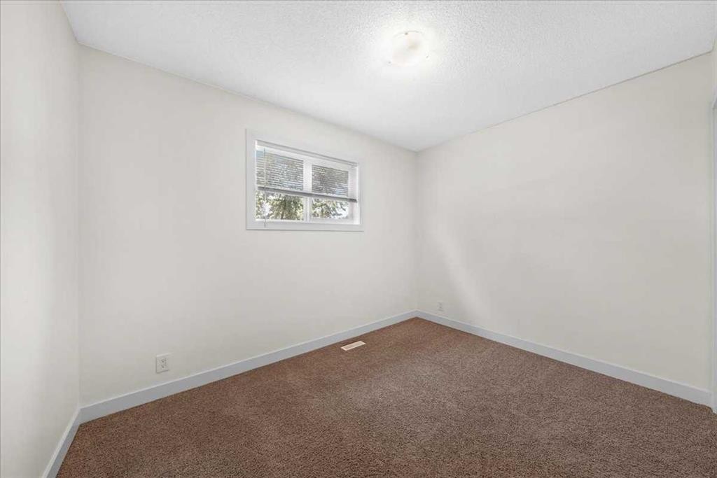 61 Falmere Way Ne, Calgary, AB - Indoor Photo Showing Other Room