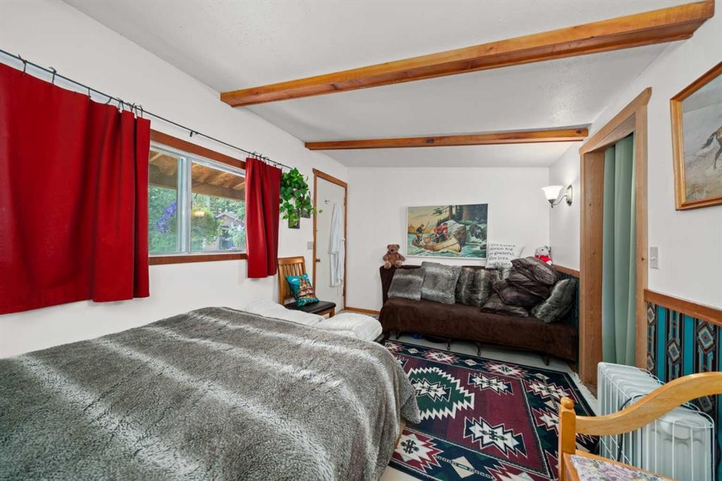 830230 Highway 1X, Rural Bighorn No. 8, M.D. Of, AB - Indoor Photo Showing Bedroom