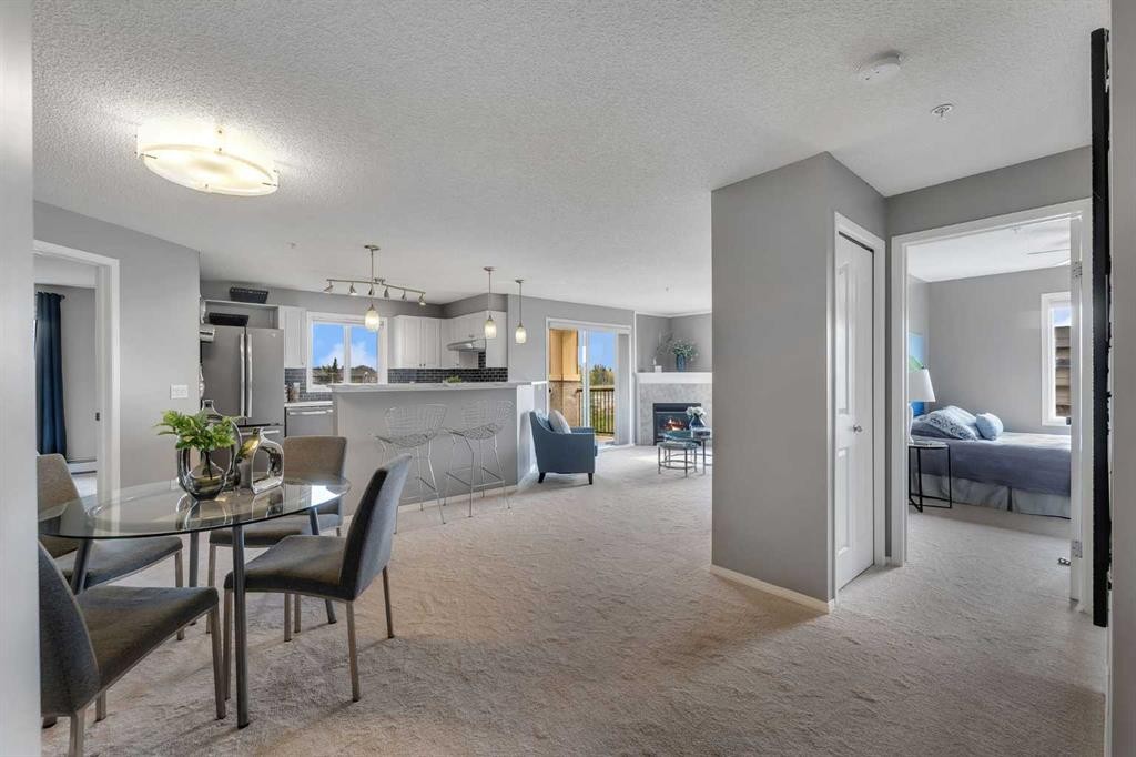8328-304 Mackenzie Way Sw, Airdrie, AB - Indoor Photo Showing Dining Room