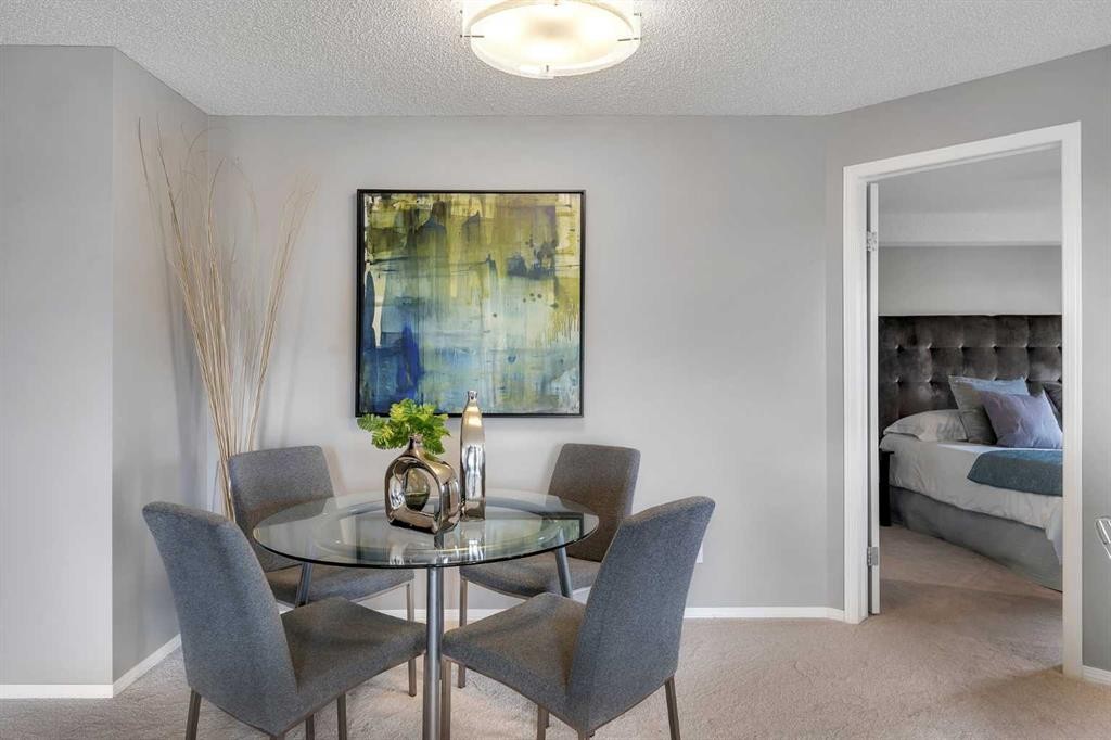 8328-304 Mackenzie Way Sw, Airdrie, AB - Indoor Photo Showing Dining Room