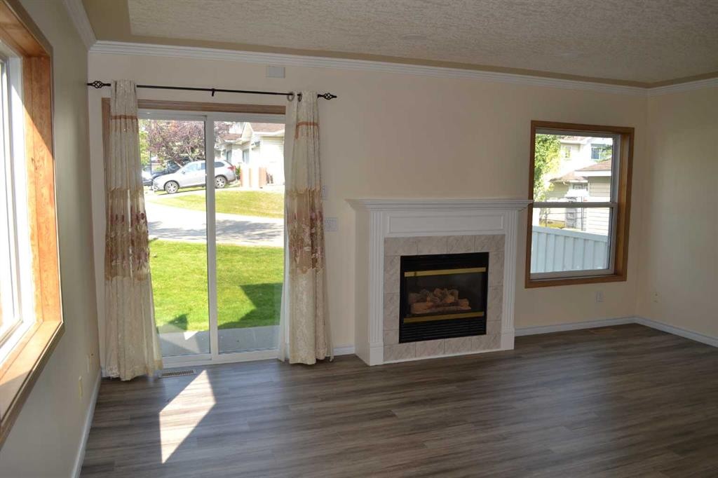 21 Country Hills Rise Nw, Calgary, AB - Indoor Photo Showing Living Room With Fireplace