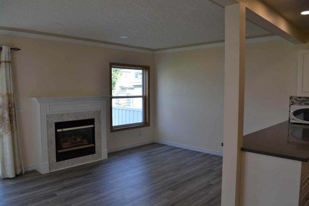 21 Country Hills Rise Nw, Calgary, AB - Indoor Photo Showing Living Room With Fireplace