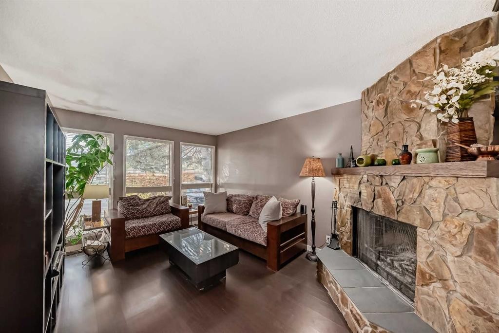 554 Whitehill Place Ne, Calgary, AB - Indoor Photo Showing Living Room With Fireplace