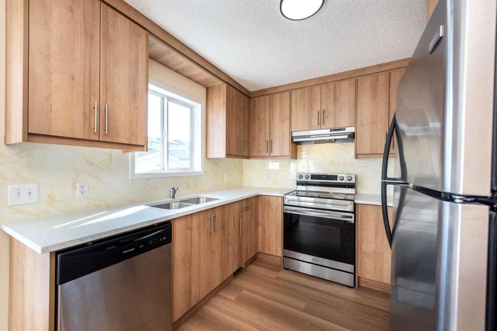 216 Hidden Hills Road Nw, Calgary, AB - Indoor Photo Showing Kitchen With Double Sink