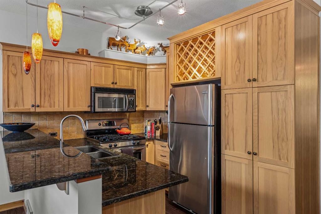 1103-70 Dyrgas Gate, Canmore, AB - Indoor Photo Showing Kitchen With Double Sink