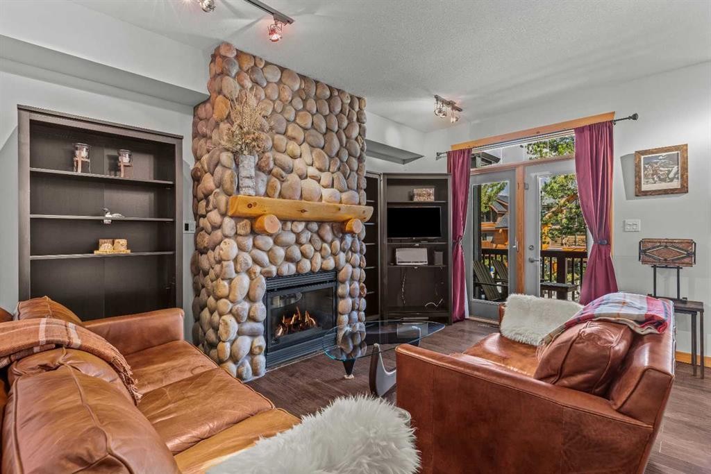 1103-70 Dyrgas Gate, Canmore, AB - Indoor Photo Showing Living Room With Fireplace