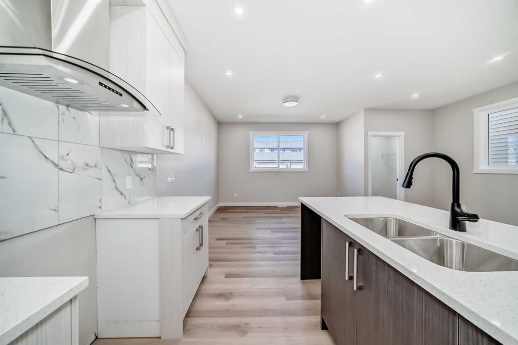 112 Belvedere Park Se, Calgary, AB - Indoor Photo Showing Kitchen With Double Sink