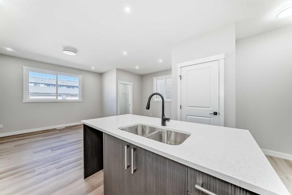 112 Belvedere Park Se, Calgary, AB - Indoor Photo Showing Kitchen With Double Sink