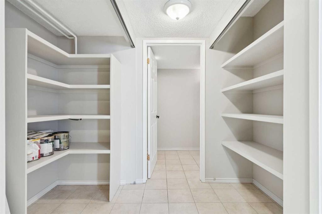 102-7416 Hunterview Drive Nw, Calgary, AB - Indoor With Storage