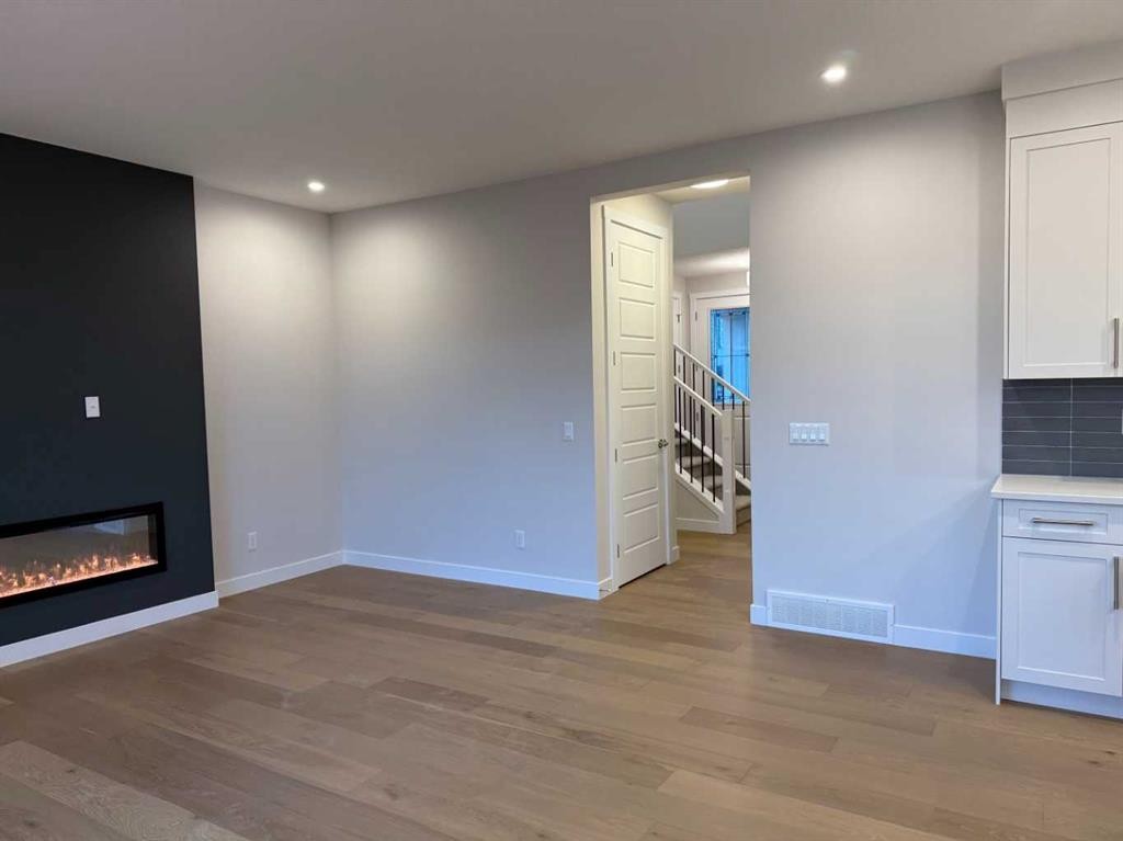51 Sunrise Heath, Cochrane, AB - Indoor With Fireplace