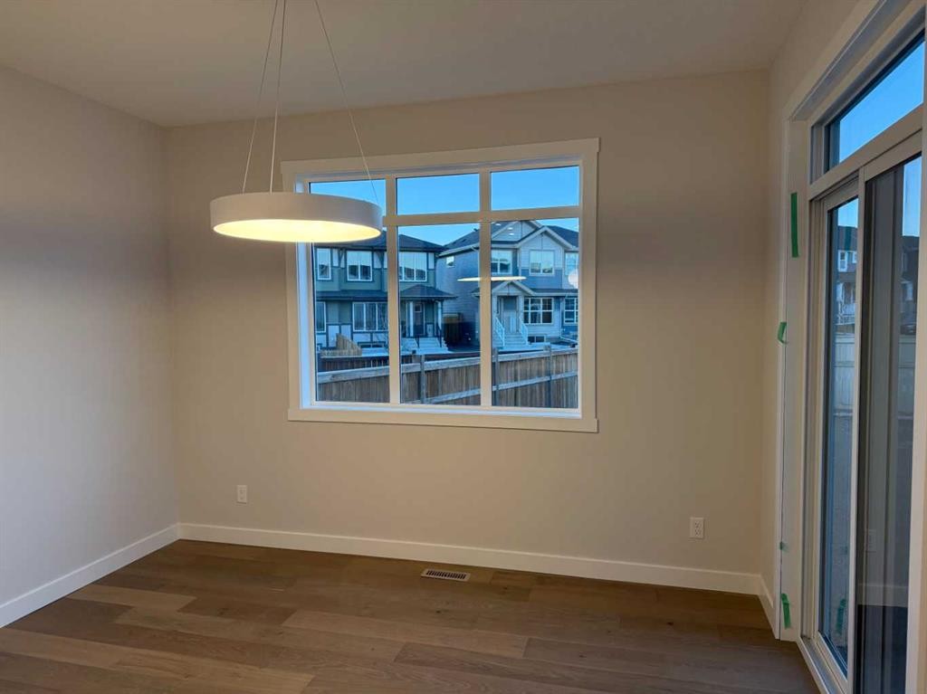 51 Sunrise Heath, Cochrane, AB - Indoor Photo Showing Other Room