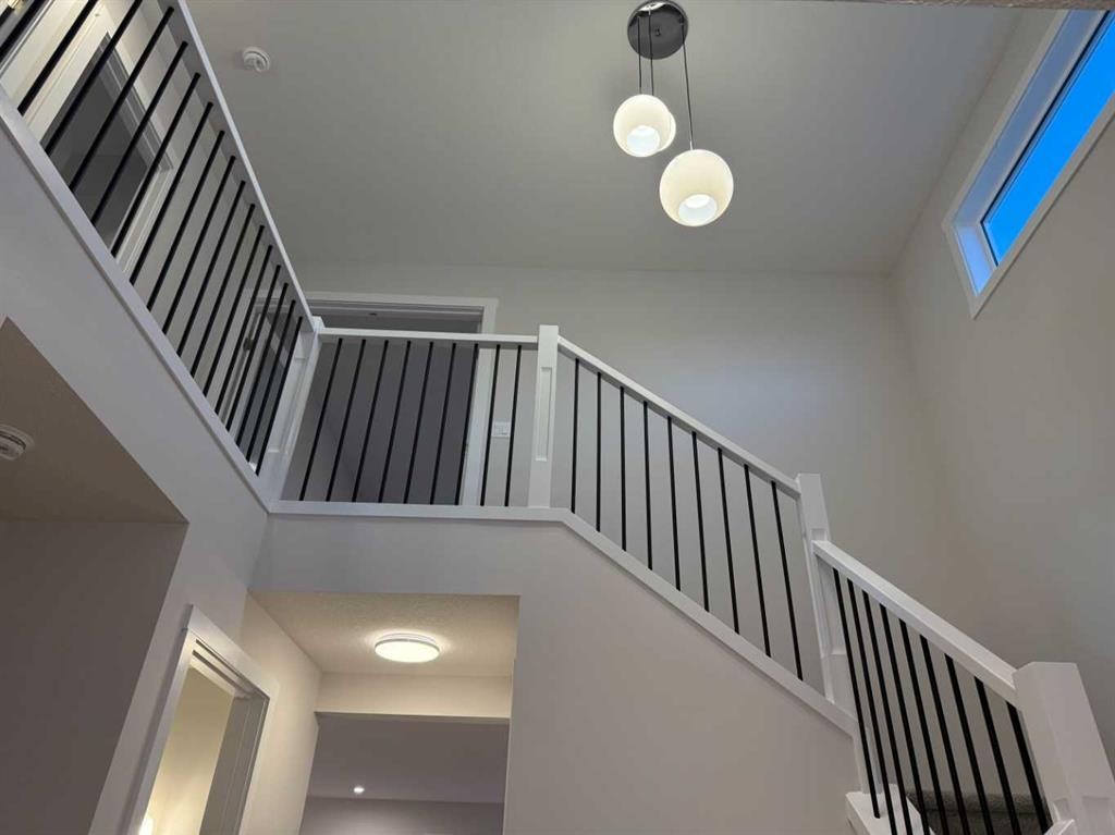 51 Sunrise Heath, Cochrane, AB - Indoor Photo Showing Other Room