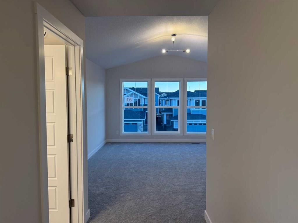 51 Sunrise Heath, Cochrane, AB - Indoor Photo Showing Other Room