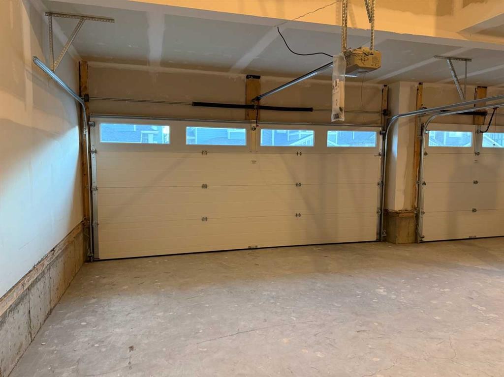 51 Sunrise Heath, Cochrane, AB - Indoor Photo Showing Garage