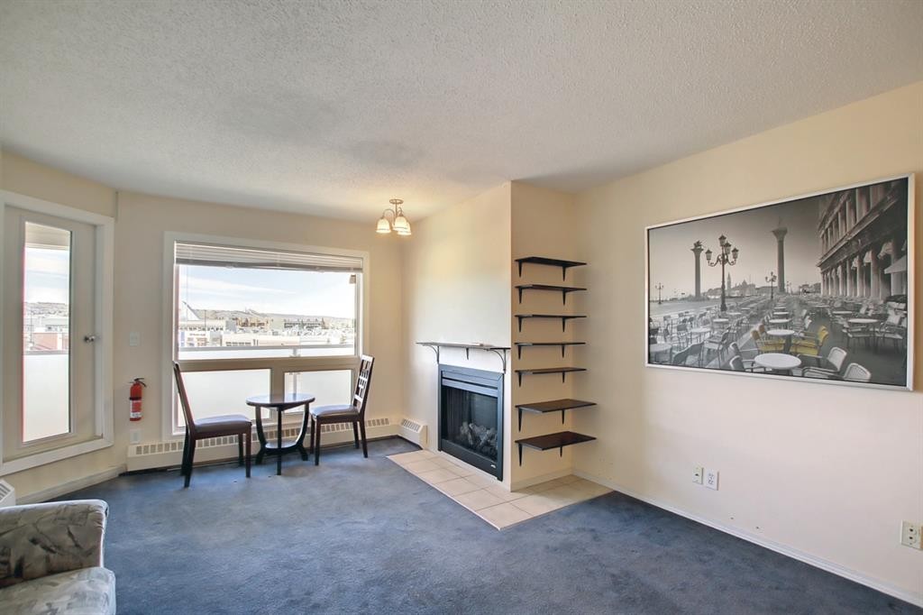 404-3727 42 Street Nw, Calgary, AB - Indoor Photo Showing Living Room With Fireplace