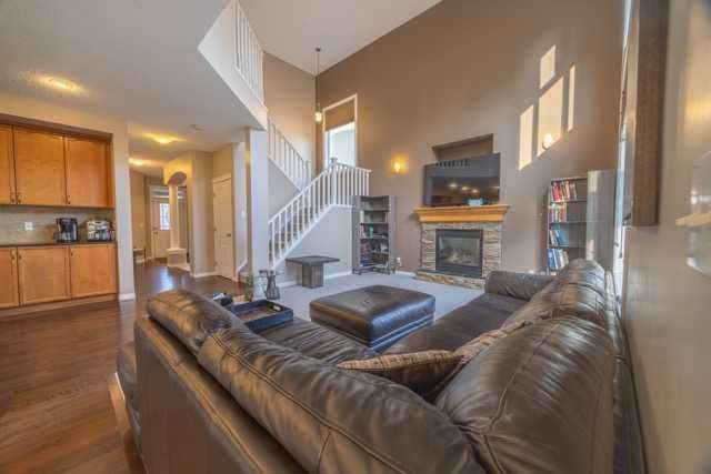 28 Crestmont Way Sw, Calgary, AB - Indoor Photo Showing Living Room With Fireplace