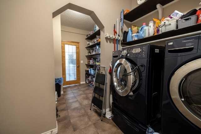 28 Crestmont Way Sw, Calgary, AB - Indoor Photo Showing Laundry Room