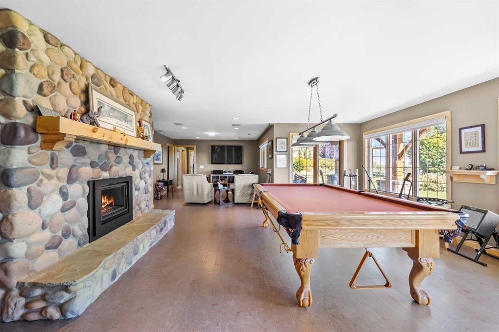98 Equestrian Drive, Rural Rocky View County, AB - Indoor Photo Showing Other Room With Fireplace
