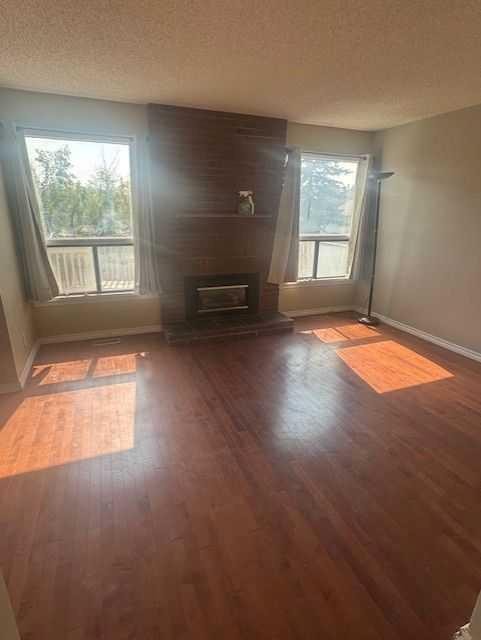 8007 Ranchview Drive Nw, Calgary, AB - Indoor With Fireplace