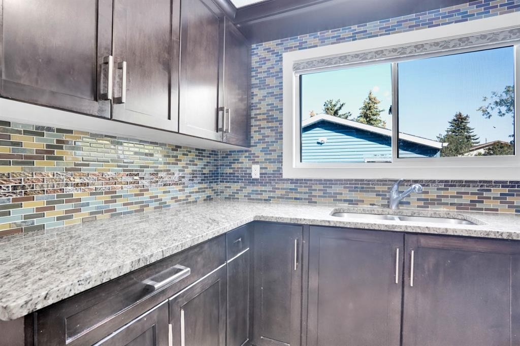 120 Tararidge Close Ne, Calgary, AB - Indoor Photo Showing Kitchen With Double Sink