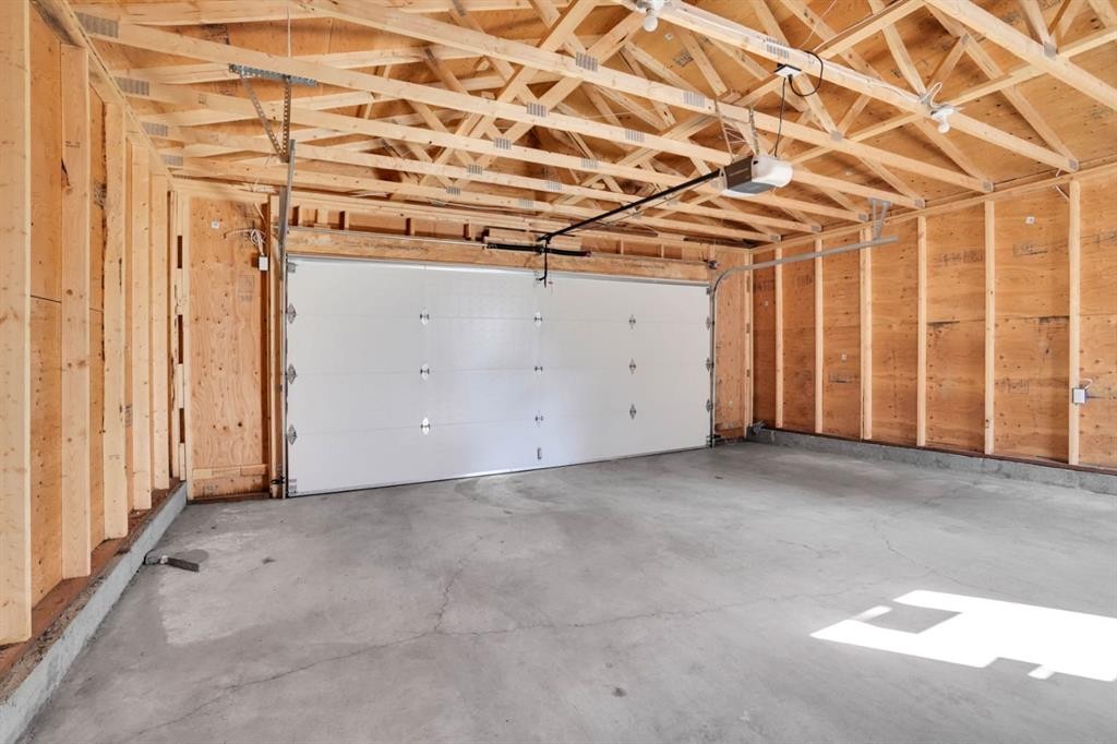 120 Tararidge Close Ne, Calgary, AB - Indoor Photo Showing Garage