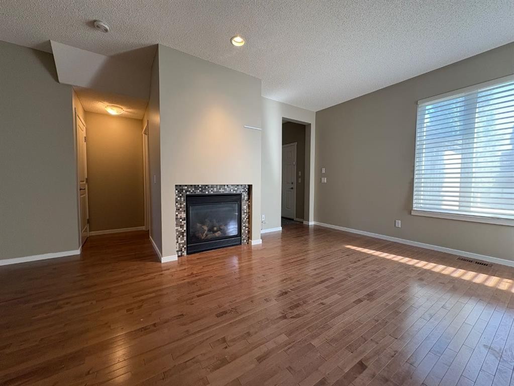 135 Chapalina Square Se, Calgary, AB - Indoor Photo Showing Living Room With Fireplace
